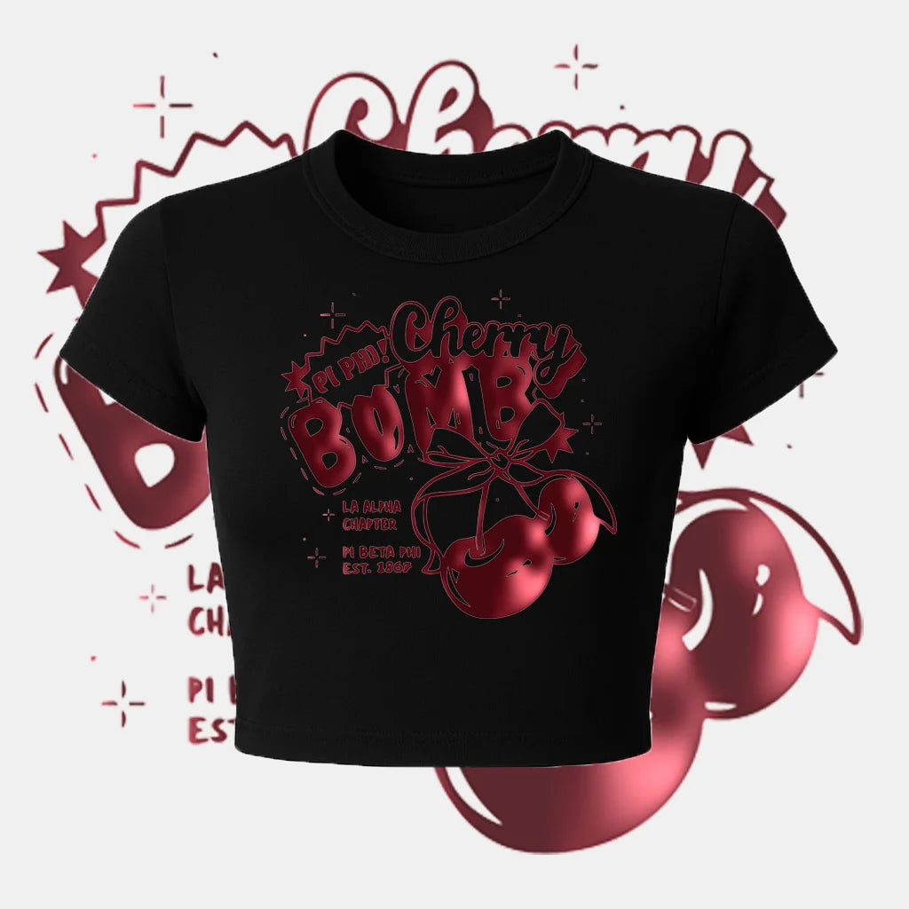 Black crop top with red cherry graphic and text on a white background